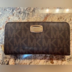 Michael Kors Monogram Classic Logo Zipper Wallets. Pre-loved clean condition.